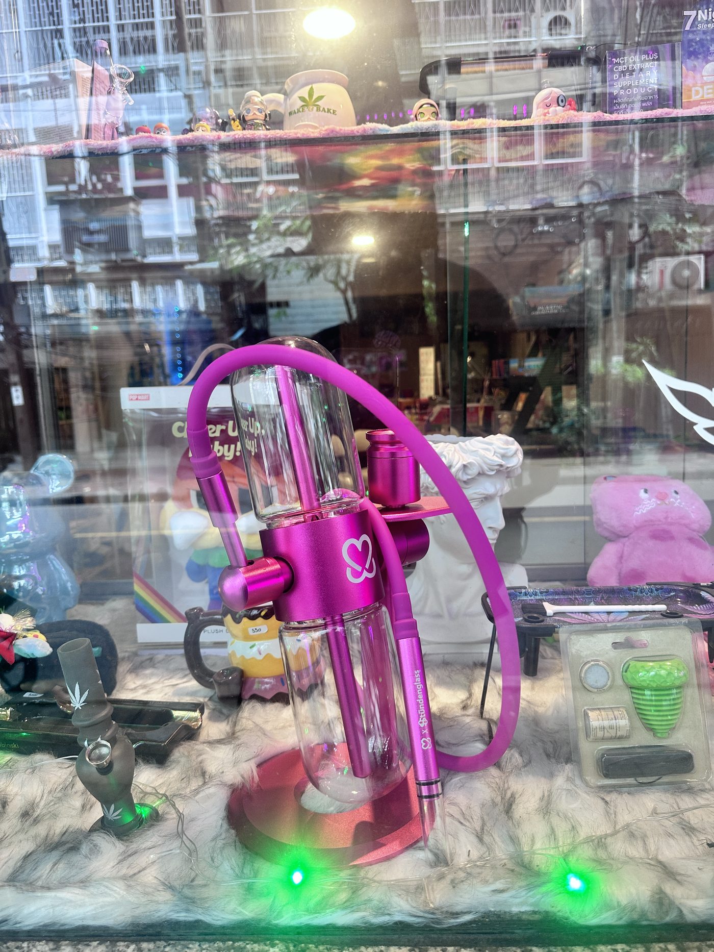 Decorative glass water pipe on display in Euphoria dispensary's window